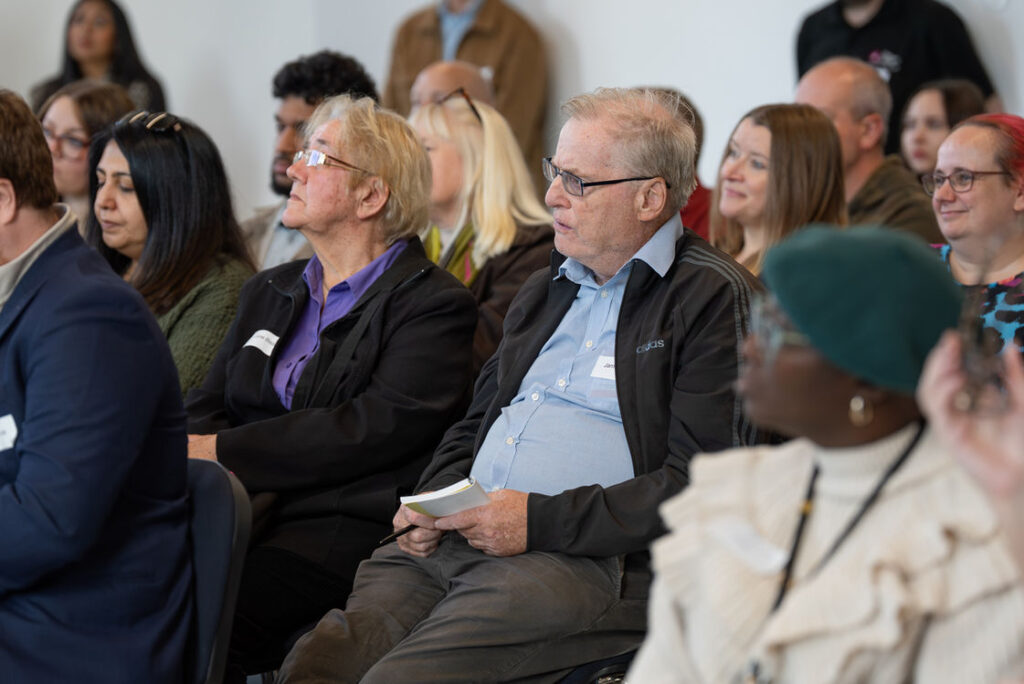 Attendees seated in the audience at a West Midlands cyber community event