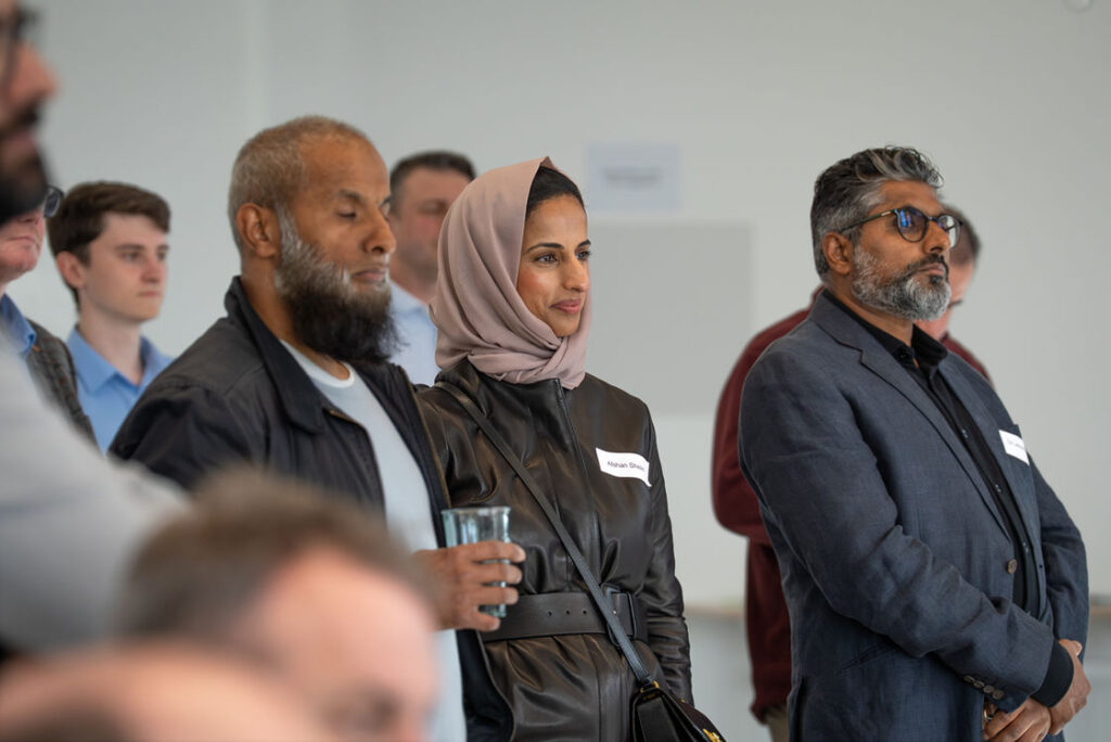 Three people talking during a networking break